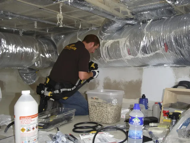 Smithfield Air Duct Cleaning specialist performing professional mold removal from air ducts in Smithfield