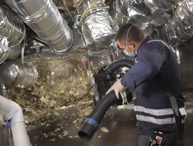 Smithfield Air Duct Cleaning specialist operating negative pressure cleaning equipment for thorough duct maintenance in Smithfield