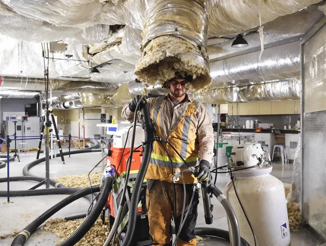 Professional vacuum insulation removal by Smithfield Air Duct Cleaning expert in Smithfield